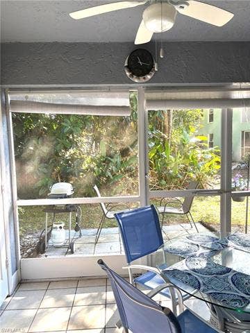 28230 Pine Haven Way, #68, Bonita Springs, FL 34135 Unfurnished sunroom featuring ceiling fan