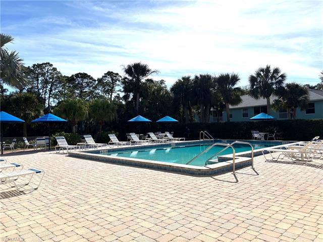 28230 Pine Haven Way, #68, Bonita Springs, FL 34135 View of pool featuring a patio area