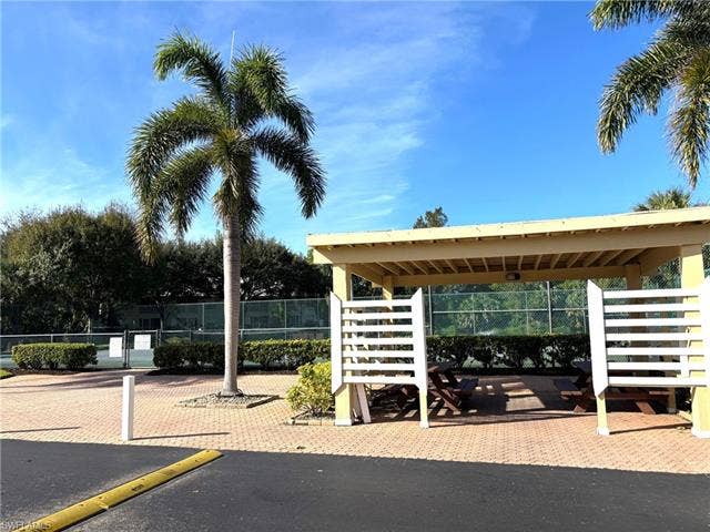 28230 Pine Haven Way, #68, Bonita Springs, FL 34135 View of vehicle parking featuring tennis court