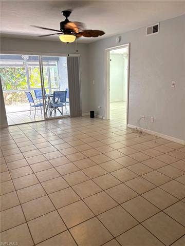 28230 Pine Haven Way, #68, Bonita Springs, FL 34135 Empty room with ceiling fan and light tile patterned flooring