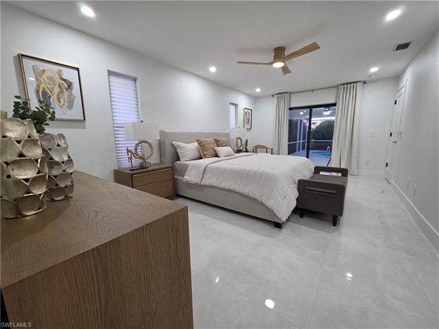 125 41st Ter, Cape Coral, FL 33904 Bedroom featuring access to exterior, recessed lighting, a ceiling fan, and light tile patterned floors