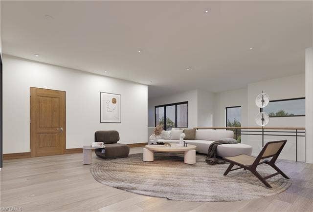 437 Heathwood Dr, Marco Island, FL 34145 Living area featuring light wood finished floors, baseboards, and recessed lighting