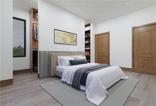 437 Heathwood Dr, Marco Island, FL 34145 Bedroom featuring light wood finished floors and baseboards