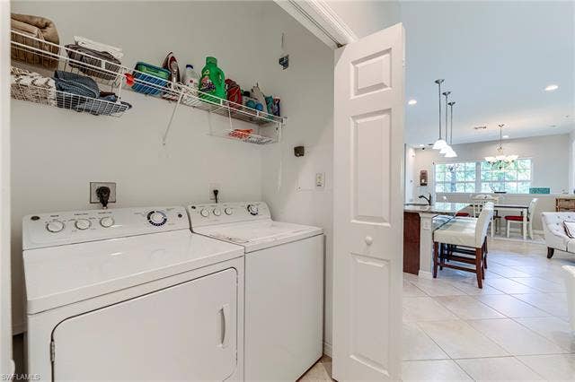 8510 Violeta St, #203, Estero, FL 34135 Laundry room with light tile patterned floors, separate washer and dryer, and recessed lighting