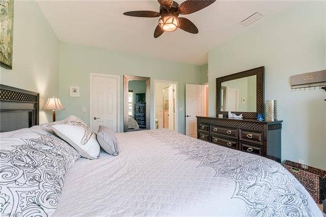 8510 Violeta St, #203, Estero, FL 34135 Bedroom featuring a ceiling fan and connected bathroom