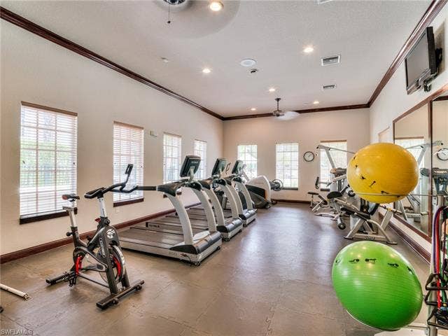 8510 Violeta St, #203, Estero, FL 34135 Gym featuring crown molding, recessed lighting, ceiling fan, and a textured ceiling