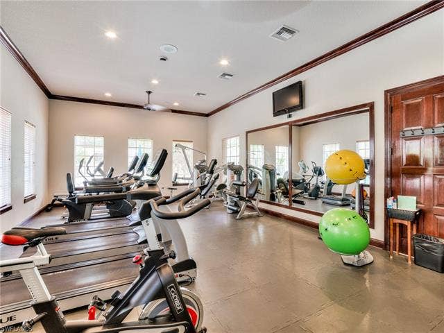 8510 Violeta St, #203, Estero, FL 34135 Exercise room featuring crown molding and recessed lighting