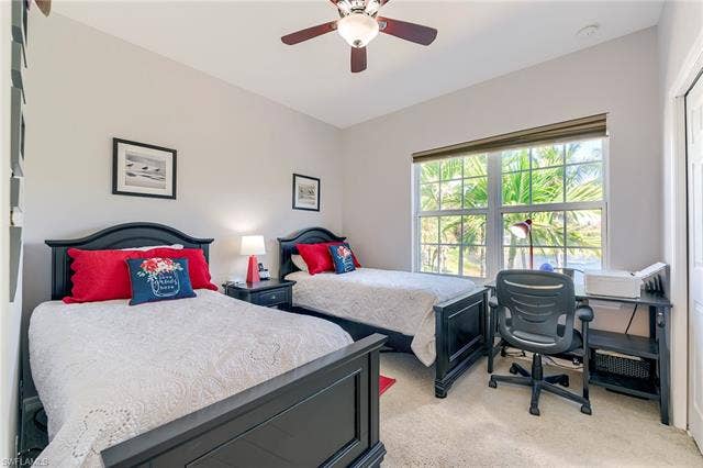 8510 Violeta St, #203, Estero, FL 34135 Bedroom featuring light colored carpet and ceiling fan
