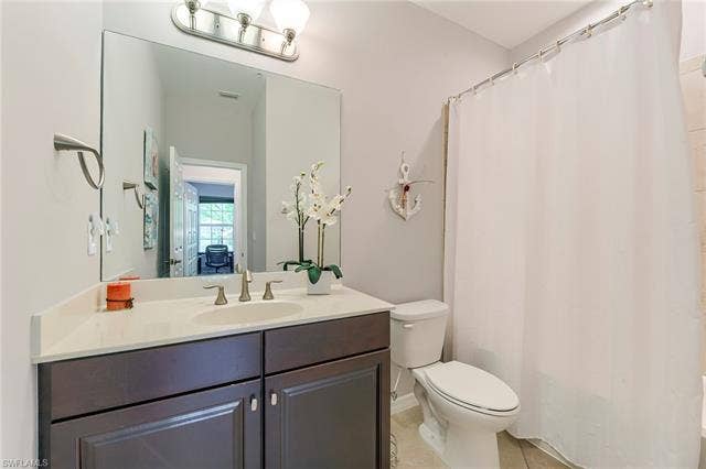 8510 Violeta St, #203, Estero, FL 34135 Full bath with vanity and light tile patterned floors