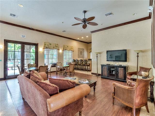 8510 Violeta St, #203, Estero, FL 34135 Living area featuring ornamental molding, french doors, a ceiling fan, recessed lighting, and wood finished floors