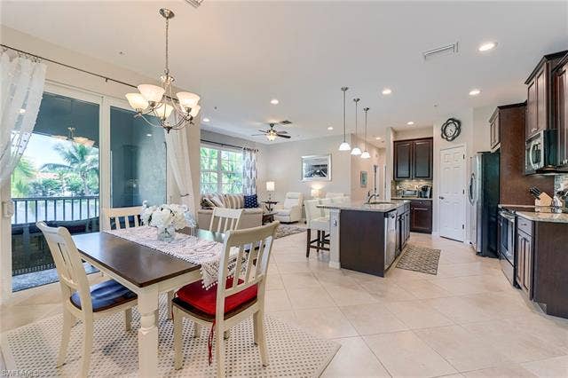 8510 Violeta St, #203, Estero, FL 34135 Dining space featuring ceiling fan, a chandelier, light tile patterned floors, and recessed lighting