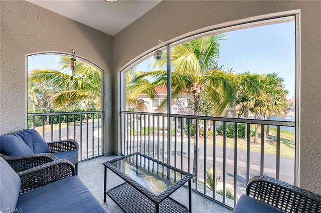 8510 Violeta St, #203, Estero, FL 34135 Balcony featuring a sunroom