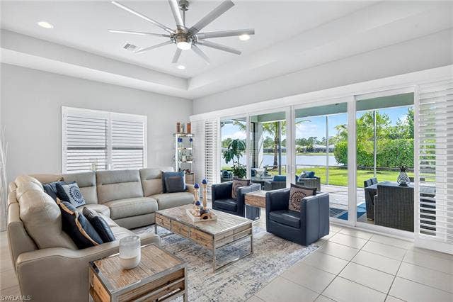 16717 Gilroy St, Bonita Springs, FL 34135 Airy, bright and spacious! This great room comfortably seats 7 plus room to pull up more chairs for book club! Wood plantation shutters across all 4 center opening doors to covered, extended lanai area.