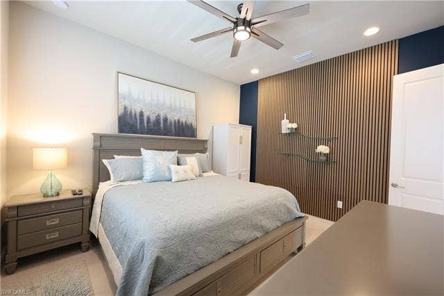 16717 Gilroy St, Bonita Springs, FL 34135 3rd Bedroom or Den featuring an accent wall, and a ceiling fan