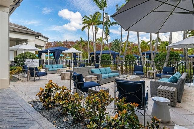 16717 Gilroy St, Bonita Springs, FL 34135 Firepit area adjacent to outdoor bar and restaurant seating area.