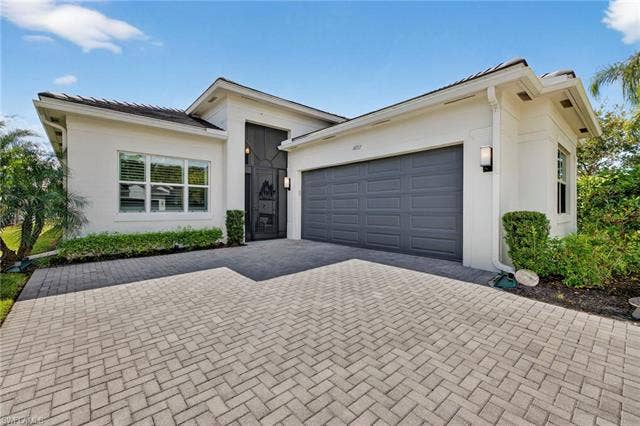 16717 Gilroy St, Bonita Springs, FL 34135 SIDE LOADING garage makes for a more elegant front of home!