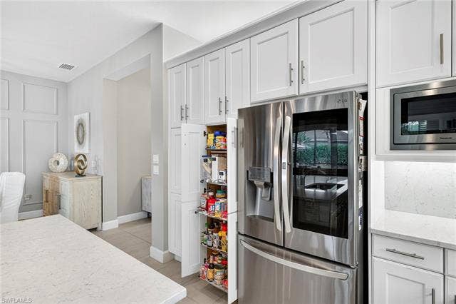 16717 Gilroy St, Bonita Springs, FL 34135 Upgraded appliances plus pull-outs in pantry and every lower level cabinet!