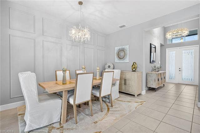 16717 Gilroy St, Bonita Springs, FL 34135 BEAUTIFUL decorative picture frame accent wall in dining area...