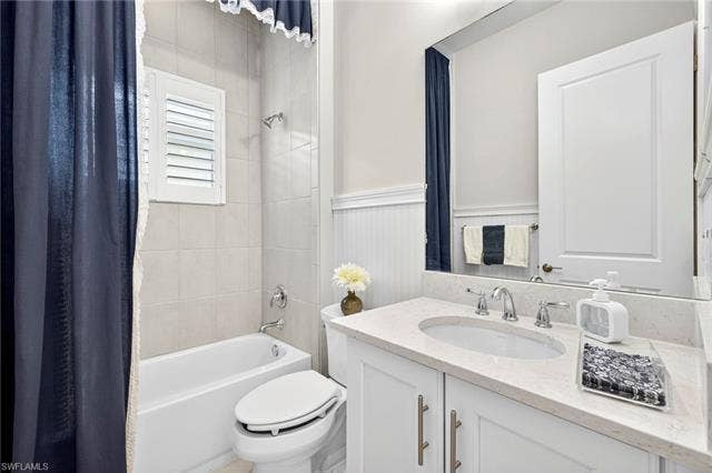 16717 Gilroy St, Bonita Springs, FL 34135 3rd full bath features floor to ceiling tile and there are even wood plaintation shutters there, also!