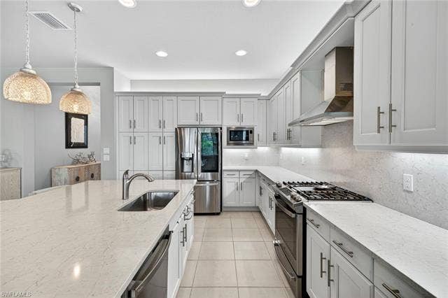 16717 Gilroy St, Bonita Springs, FL 34135 Elegance and gas cooking!!! Soft close drawers, microwave is air fryer and convection oven, too! Upgraded cabinets a huge plus!
