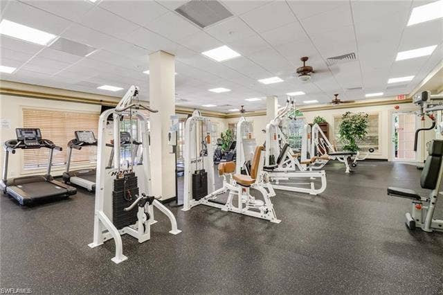 10127 Villagio Palms Way, #203, Estero, FL 33928 Exercise room featuring a drop ceiling and a ceiling fan