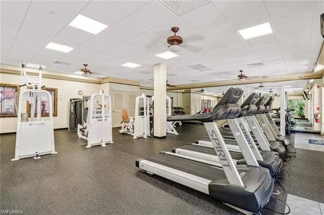 10127 Villagio Palms Way, #203, Estero, FL 33928 Workout area featuring ceiling fan and a paneled ceiling