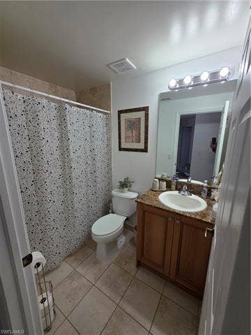 10127 Villagio Palms Way, #203, Estero, FL 33928 Full bath with a shower with curtain, vanity, and light tile patterned floors