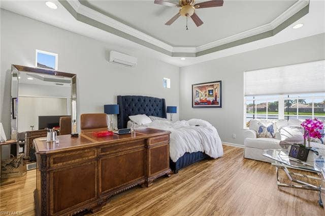 22140 Long Leaf Trail Dr, Estero, FL 34135 Bedroom with an office area, light wood-style floors, recessed lighting, crown molding, and a ceiling fan