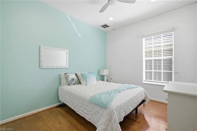 22140 Long Leaf Trail Dr, Estero, FL 34135 Bedroom featuring wood finished floors and ceiling fan