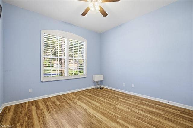 22140 Long Leaf Trail Dr, Estero, FL 34135 Spare room featuring wood finished floors and ceiling fan