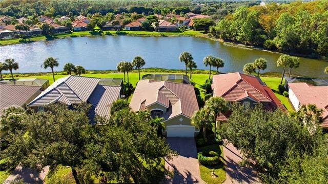 22140 Long Leaf Trail Dr, Estero, FL 34135 Aerial view of residential area featuring a nearby body of water
