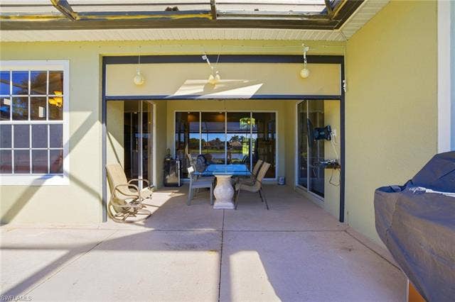 22140 Long Leaf Trail Dr, Estero, FL 34135 View of patio with a ceiling fan and outdoor dining area