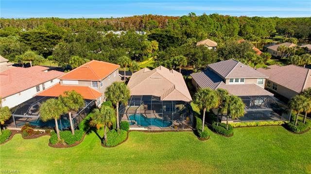22140 Long Leaf Trail Dr, Estero, FL 34135 Aerial view of residential area with a pool area