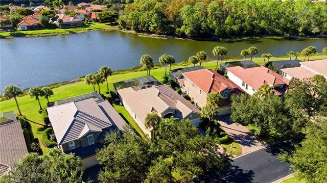 22140 Long Leaf Trail Dr, Estero, FL 34135 Aerial view of residential area with a large body of water