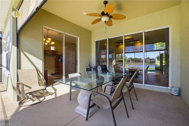 22140 Long Leaf Trail Dr, Estero, FL 34135 View of patio / terrace featuring a ceiling fan, a water view, and outdoor dining space