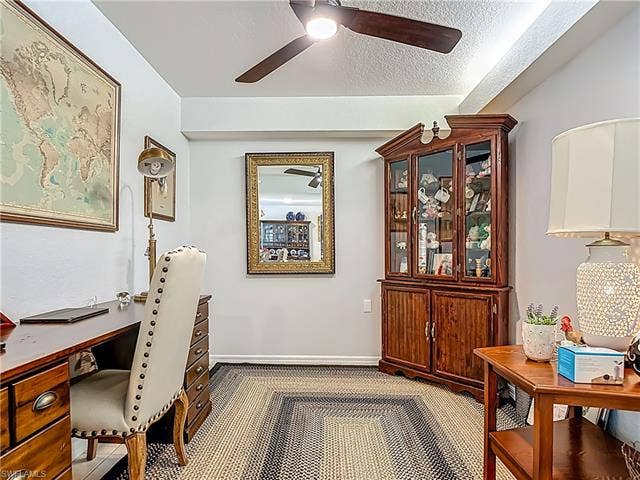 25735 Lake Amelia Way, #103, Bonita Springs, FL 34135 Carpeted home office with a textured ceiling