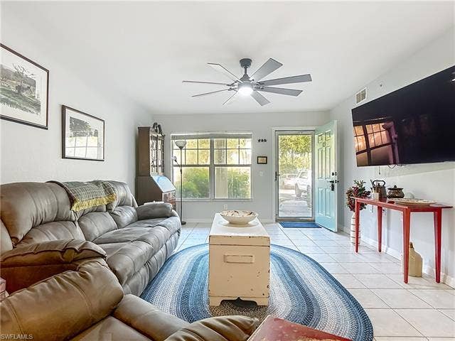 25735 Lake Amelia Way, #103, Bonita Springs, FL 34135 Living room with tile patterned flooring and ceiling fan
