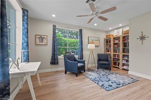 25735 Lake Amelia Way, #103, Bonita Springs, FL 34135 Living area featuring light wood-type flooring, a ceiling fan, and recessed lighting