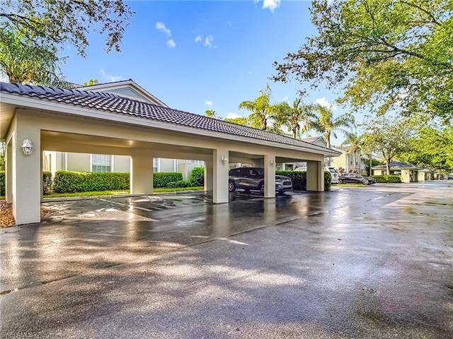 25735 Lake Amelia Way, #103, Bonita Springs, FL 34135 View of parking / parking lot