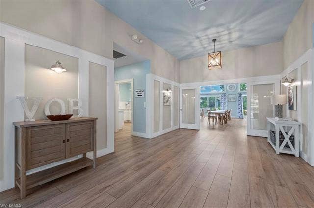 25735 Lake Amelia Way, #103, Bonita Springs, FL 34135 Entrance foyer with light wood finished floors
