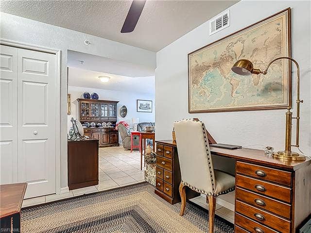 25735 Lake Amelia Way, #103, Bonita Springs, FL 34135 Office space with light tile patterned floors, a textured ceiling, and ceiling fan