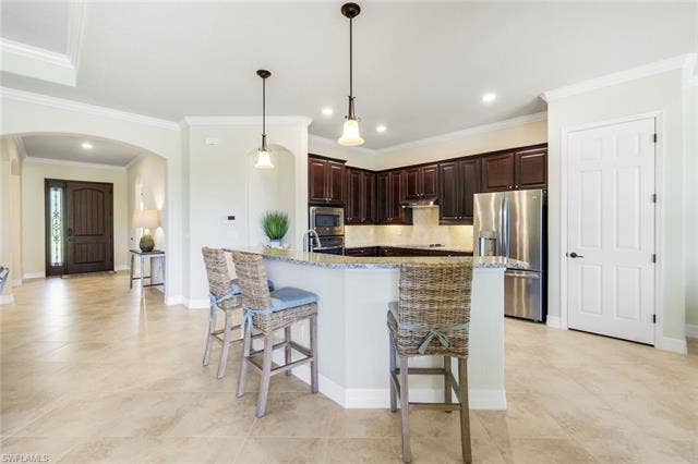 28085 Wicklow Ct, Bonita Springs, FL 34135 Entrance showing Foyer and Kitchen Area