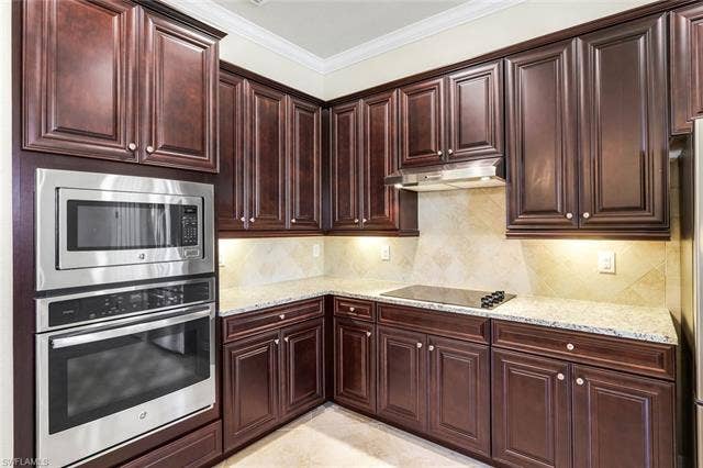 28085 Wicklow Ct, Bonita Springs, FL 34135 Kitchen featuring Wall Over, Microwave and Electric Cooktop.