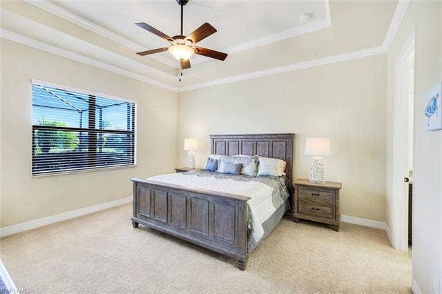 28085 Wicklow Ct, Bonita Springs, FL 34135 Primary Bedroom with Tray Ceiling and View of the Outdoors