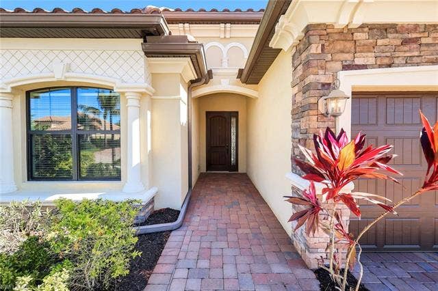 28085 Wicklow Ct, Bonita Springs, FL 34135 Enter through the Covered Entrance