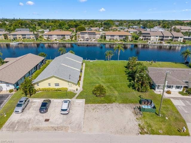 4520 5th Pl, Cape Coral, FL 33904 Aerial perspective of suburban area featuring a large body of water