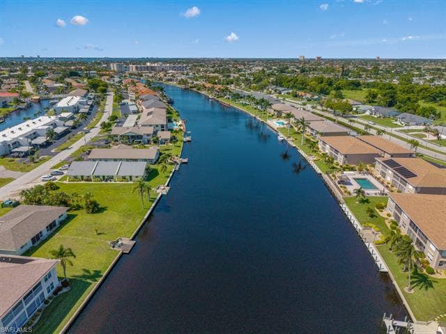 4520 5th Pl, Cape Coral, FL 33904 Aerial perspective of suburban area featuring a nearby body of water