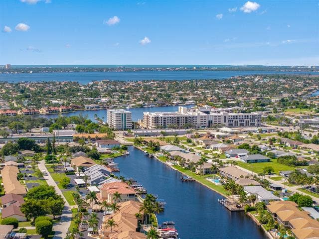 4520 5th Pl, Cape Coral, FL 33904 Aerial perspective of suburban area featuring a large body of water