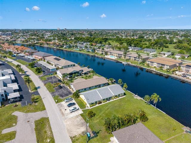 4520 5th Pl, Cape Coral, FL 33904 Aerial view of property and surrounding area with nearby suburban area