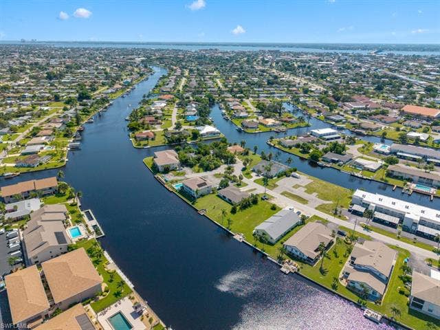 4520 5th Pl, Cape Coral, FL 33904 Aerial view of residential area with a large body of water